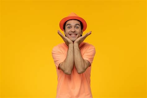 Free Photo Orange Hat Happy Handsome Pretty Guy In Orange Tshirt With