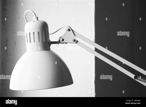 White desk lamp on black and white background, BW concept Stock Photo ...