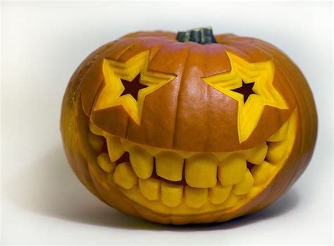 Super Fun Carved Pumpkin Idea Star Eye Glasses And Huge Round Teeth Pumpkin Carving