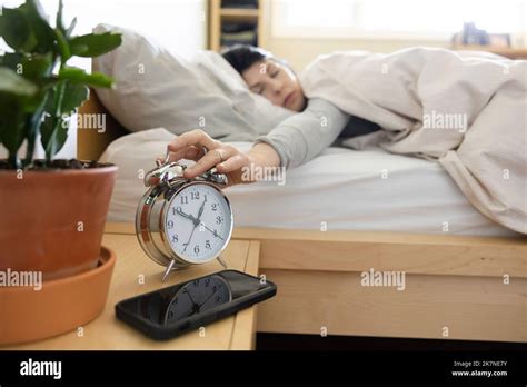 Mature Woman Snooze Alarm Clock Hi Res Stock Photography And Images Alamy