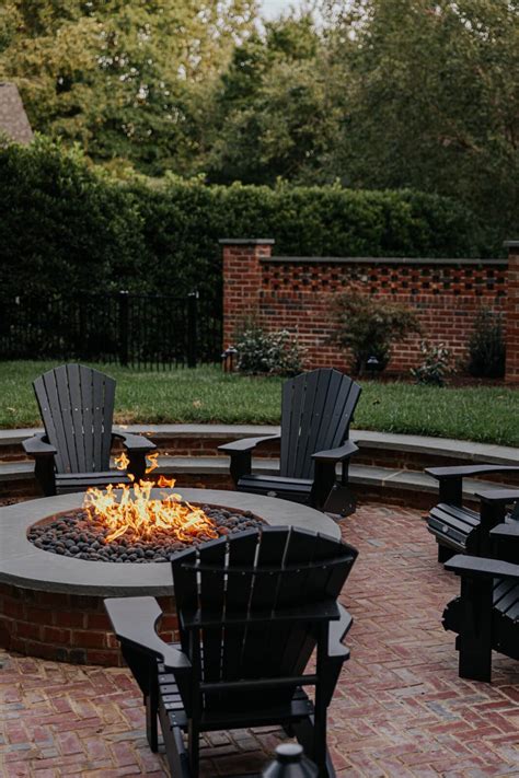 Our Sunken Fire Pit Paired With Black Adirondack Chairs