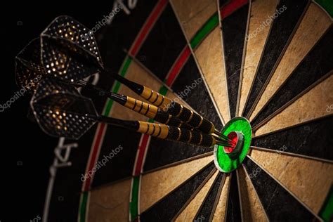 Three Darts In Bulls Eye Close Up Stock Photo By DmitryRukhlenko 60034799