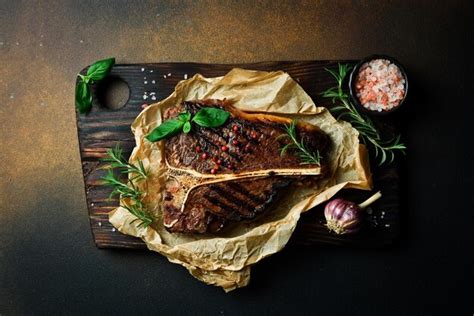 Premium Photo Tbone Steak With Rosemary On Parchment Paper Beef Steak