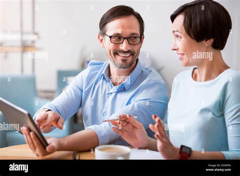 Friendly Coworkers Working Together Stock Photo Alamy