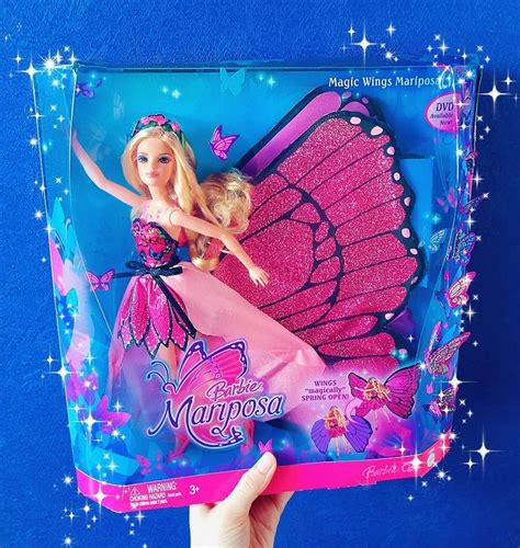 A Barbie Doll In A Pink Dress And Butterfly Wings On The Back Of A Package