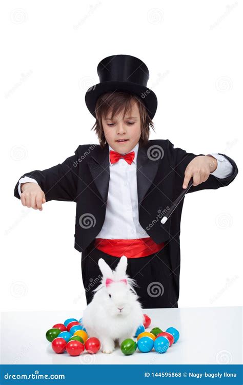 Magician Boy Perform a Magic Trick with the Easter Bunny and Some Colorful Eggs Stock Photo ...