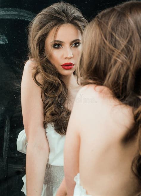 Young Slim Woman Standing At Mirror Beautiful Young Woman Looking Into