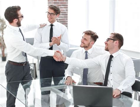 Premium Photo Business Colleagues Shaking Hands In The Workplace