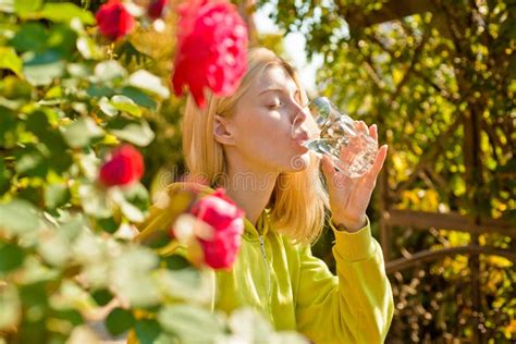 Young Charming Girl Thirsty Drinks A Glass Of Water Closing Her Eyes