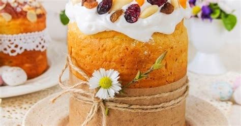 There Is A Cake That Has Been Decorated With Fruit And Nuts On Top Of It