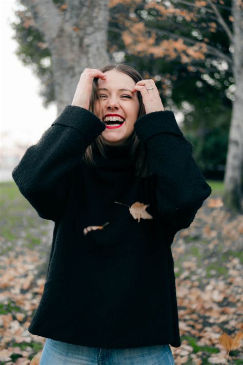 Woman Wearing Black Sweater With A Happy Face · Free Stock Photo