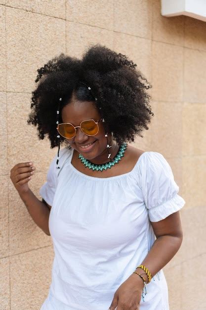 Premium Photo Latina Woman With Afro Hair Laughing In Park