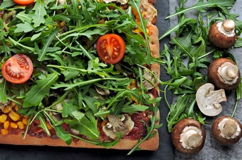 Premium Photo Vegan Pizza With Mushrooms And Fresh Arugula Square