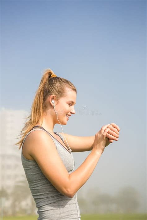 Smiling Sporty Blonde Using Smart Watch Stock Photo Image Of Mobile