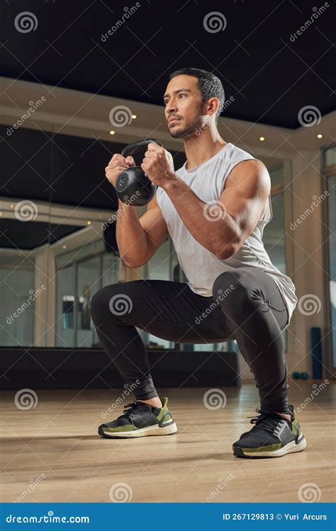 Getting Stronger With Each Squat Full Length Shot Of A Handsome Young