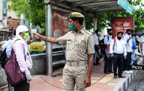 Image Of People Flout Social Distancing Norms As They Board A Bus At