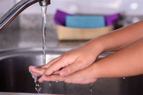 Girl Rinsing Her Hands Under The Kitchen Faucet Washing Her Hands Stock Image Image Of