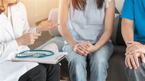 Patient Couple Consulting With Doctor Or Psychologist On Marriage