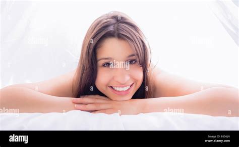 Beautiful Brunette Smiling At Camera On Bed Stock Photo Alamy