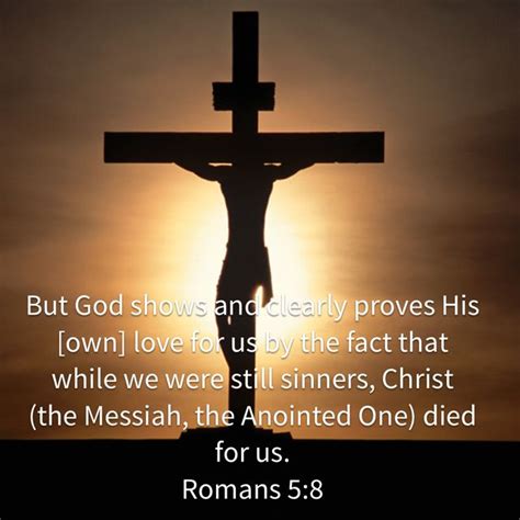 A Cross With The Sun In The Background And A Bible Verse Written Below