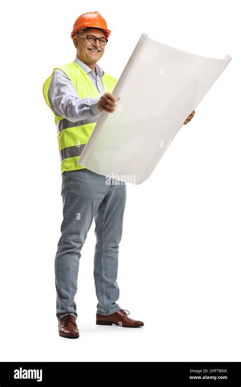 Full Length Portrait Of A Mature Male Engineer Reading A Blueprint