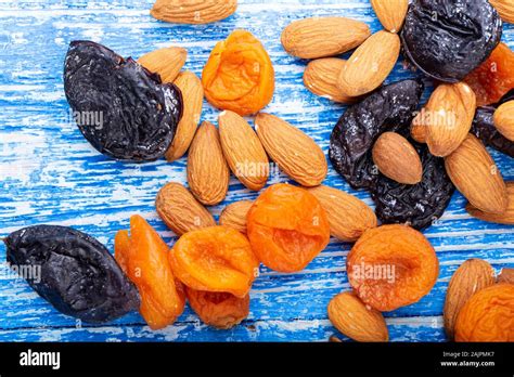 Different Dried Fruits Are Scattered On The Table Nutritious Foods For