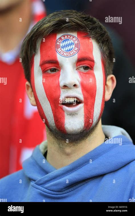 A Bayern Munich Fan Wearing Face Paint In The Stands Hi Res Stock