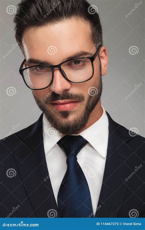 Handsome Businessman Wearing Glasses Smiles Seductively Stock Image