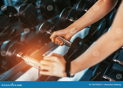 Women Hands Lifting Dumbbells Workouts With Dumbbells In A Gym Sport