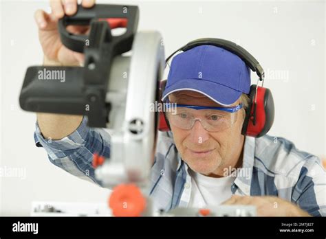Mature Man Using Circular Saw Stock Photo Alamy