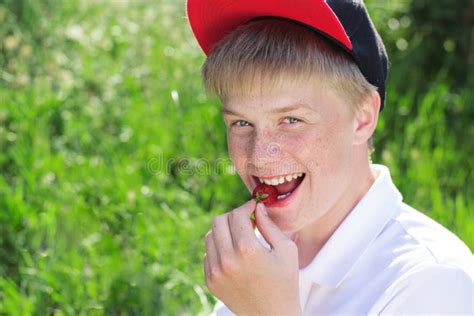 Smiling Boy Is Wearing Red Cap Eating Strawberry Stock Photo Image Of