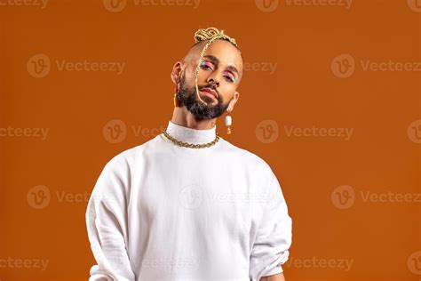 Black Latin Gay Man Isolated On Orange Background Stock Photo At Vecteezy
