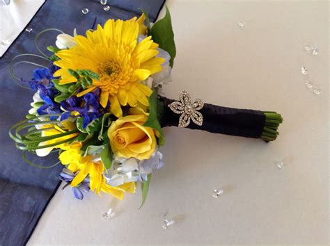 Yellow Gerberas Roses Blue Hydrangea And Blue Delphinium Add Greenery