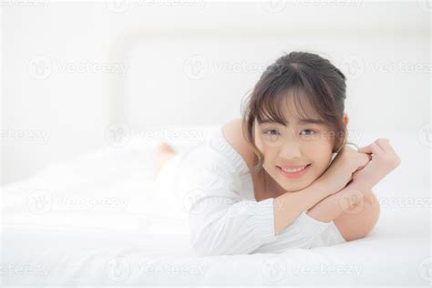 Beautiful Portrait Young Asian Woman Lying And Smile While Wake Up With Sunrise At Morning