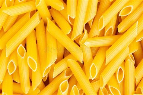 Italian Penne Rigate Macaroni Pasta Raw Food Background Stock Photo