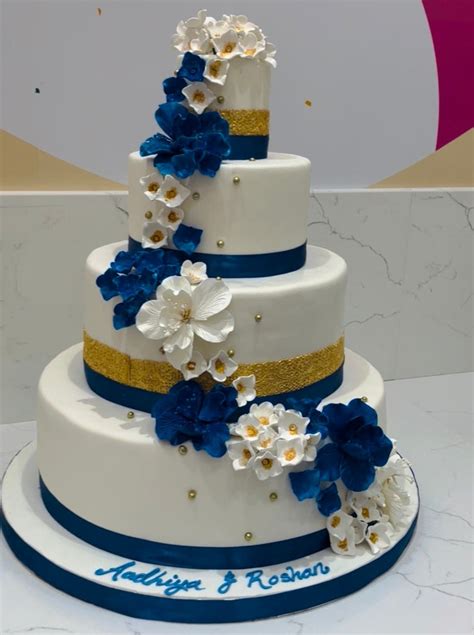 ROYAL BLUE & GOLD WEDDING CAKE - Rashmi's Bakery