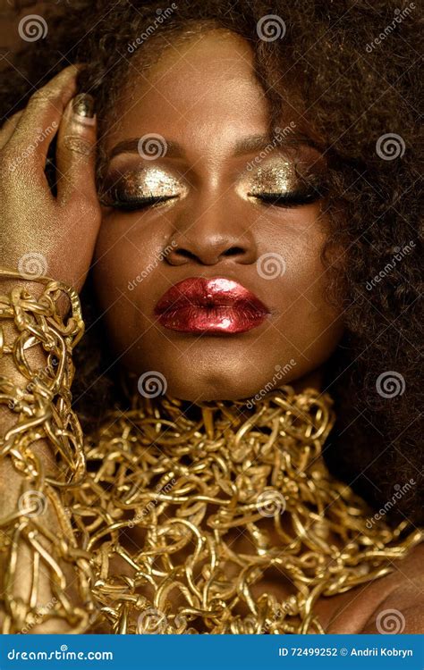 Young African American Model With Bright Red Lips Gold Makeup And