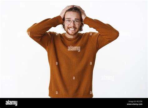 Jeez I Am In Trouble Portrait Of Nervous And Freaked Out Bearded Guy Holding Hands On Hear As