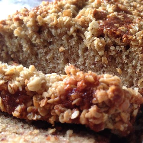 A Close Up Of A Piece Of Cake On A Plate With Crumb Toppings