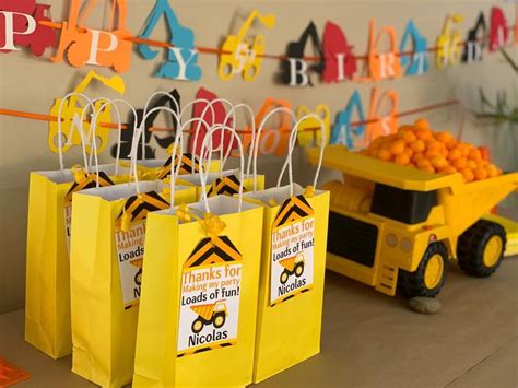 Construction Themed Birthday Party With Yellow Paper Bags And Oranges