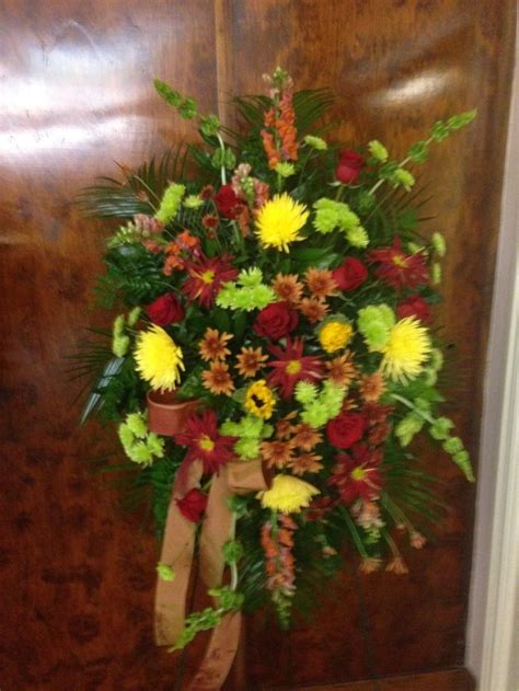 Fall Funeral Spray Using Orange Snapdragons Yellow Fuji Mums