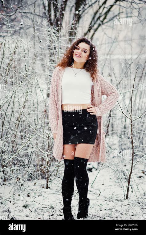 Curly Brunette Girl Background Falling Snow Wear On Warm Knitted Sweater Black Mini Skirt And