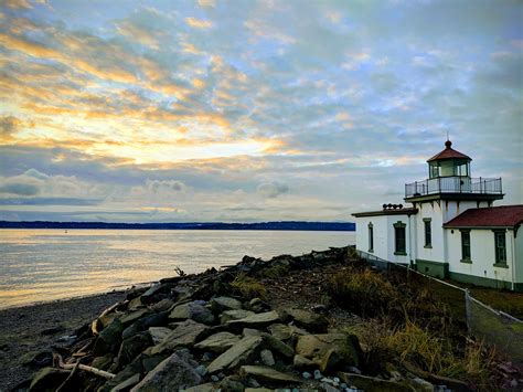 Discovery Park lighthouse at sunset the other day : r/Seattle