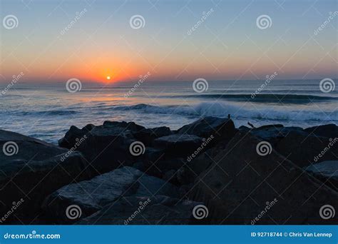 Dawn Ocean Sunrise Beach stock photo. Image of rocks - 92718744