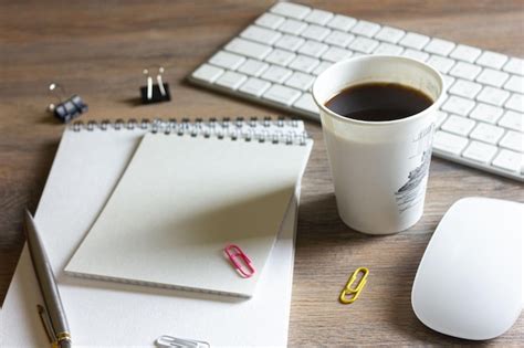 Premium Photo Notebooks Paper Clips With A Pen And Coffee On A Wooden