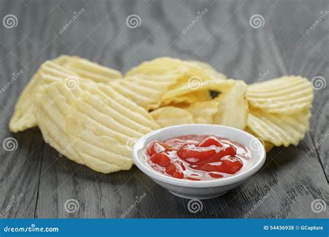 Rippled Organic Chips Wit Tomato Sauce On Wooden Stock Photo Image Of