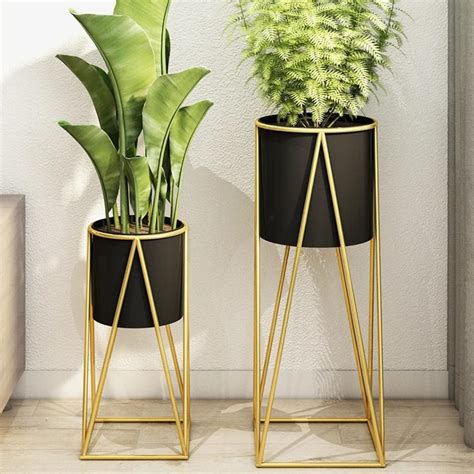 Ripley PORTA MACETERO PEDESTAL MACETA PLANTAS NEGRO DORADO