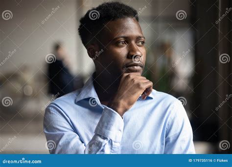 Thoughtful African American Businessman Look In Distance Pondering