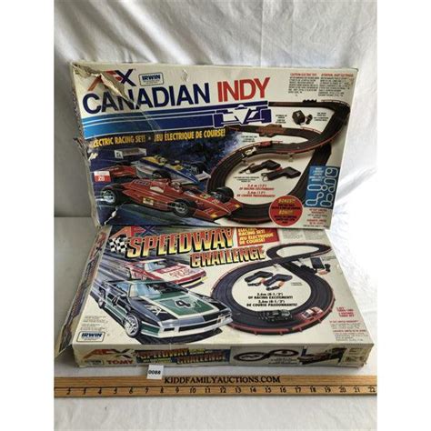 LOT OF 2 - AFX SLOT CAR SETS - EACH W / 2 CARS - Kidd Family Auctions