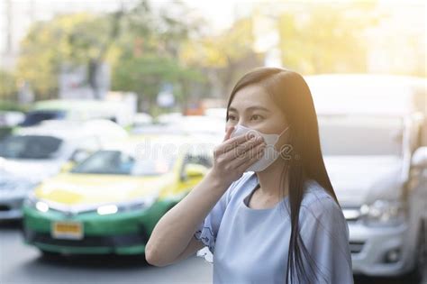 Asian Woman With Face Mask Protection While Walking On The Street